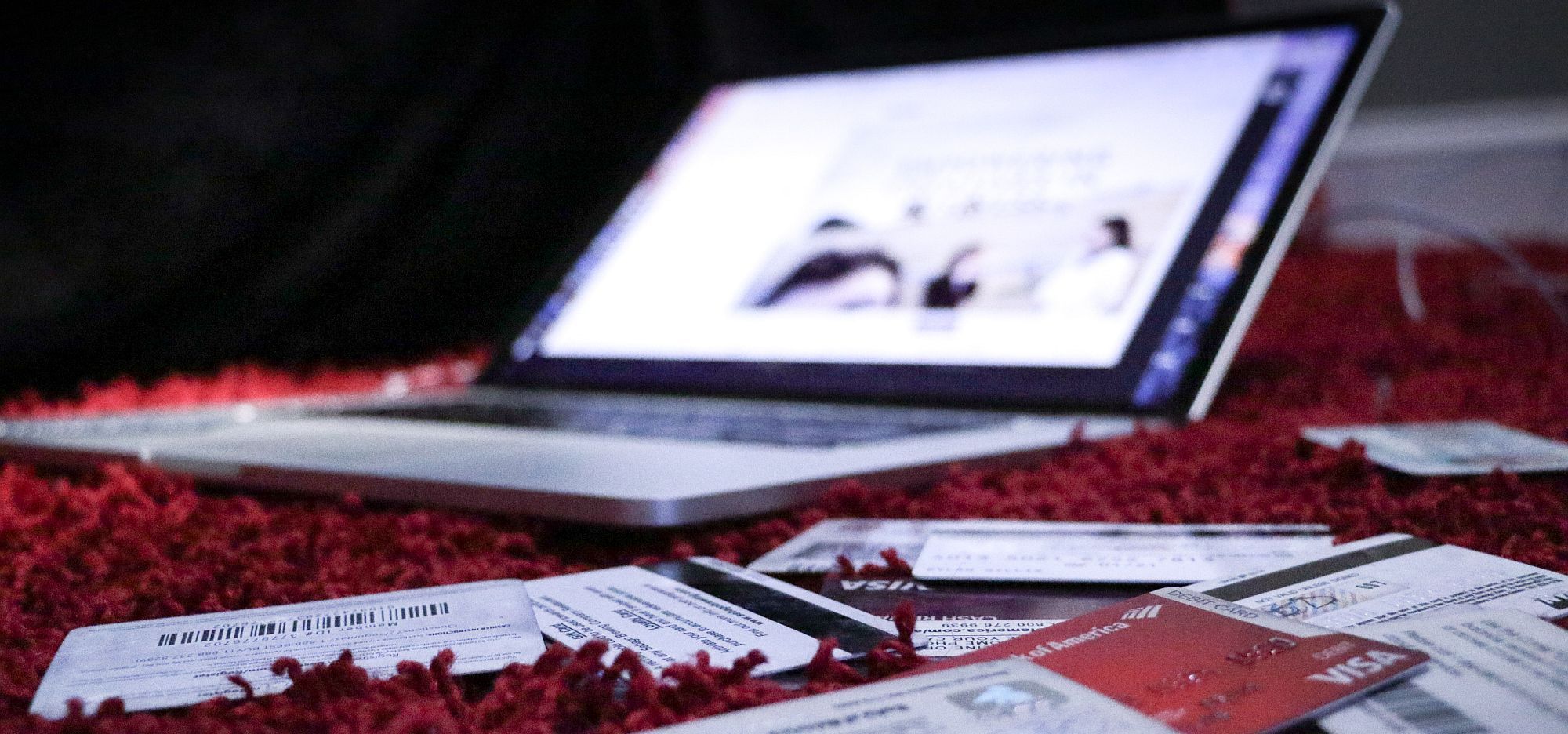 Image of a laptop and credit cards