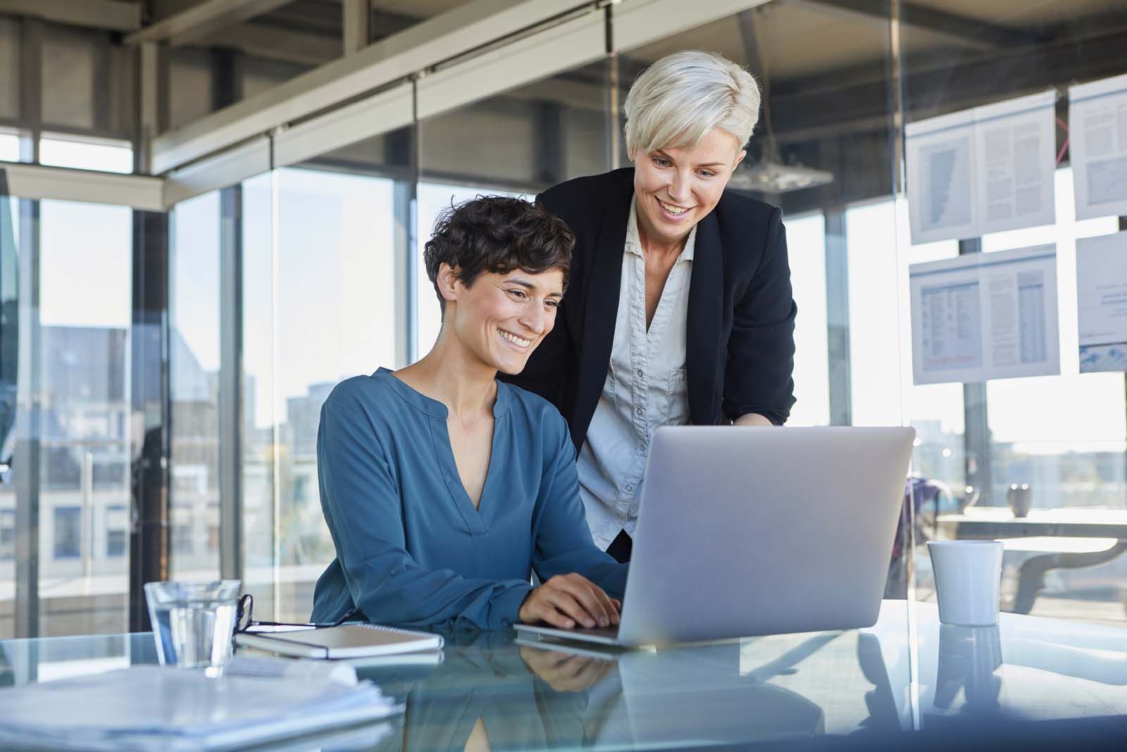 Woman smiling with laptop